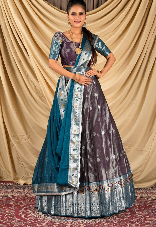 Woman wearing a traditional lehenga choli with a blue and purple