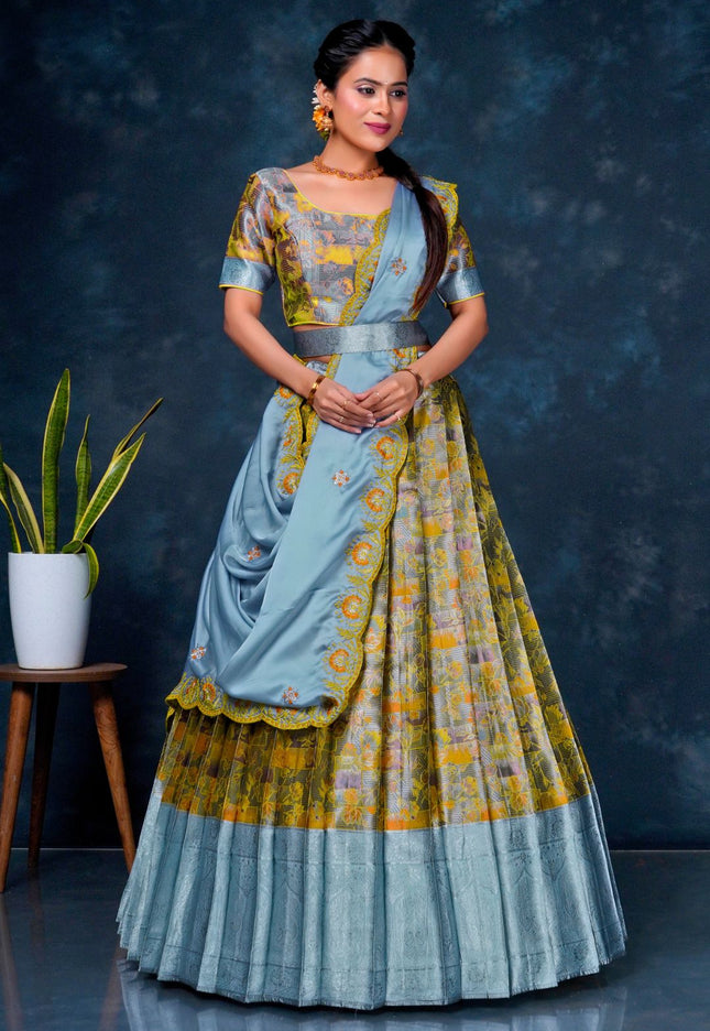 Woman wearing a traditional outfit with a blue and yellow patterned dress
