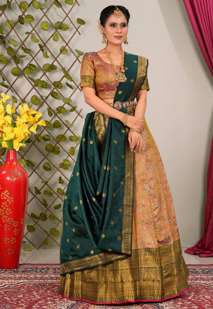 Woman in traditional lehenga choli with green and gold patterns