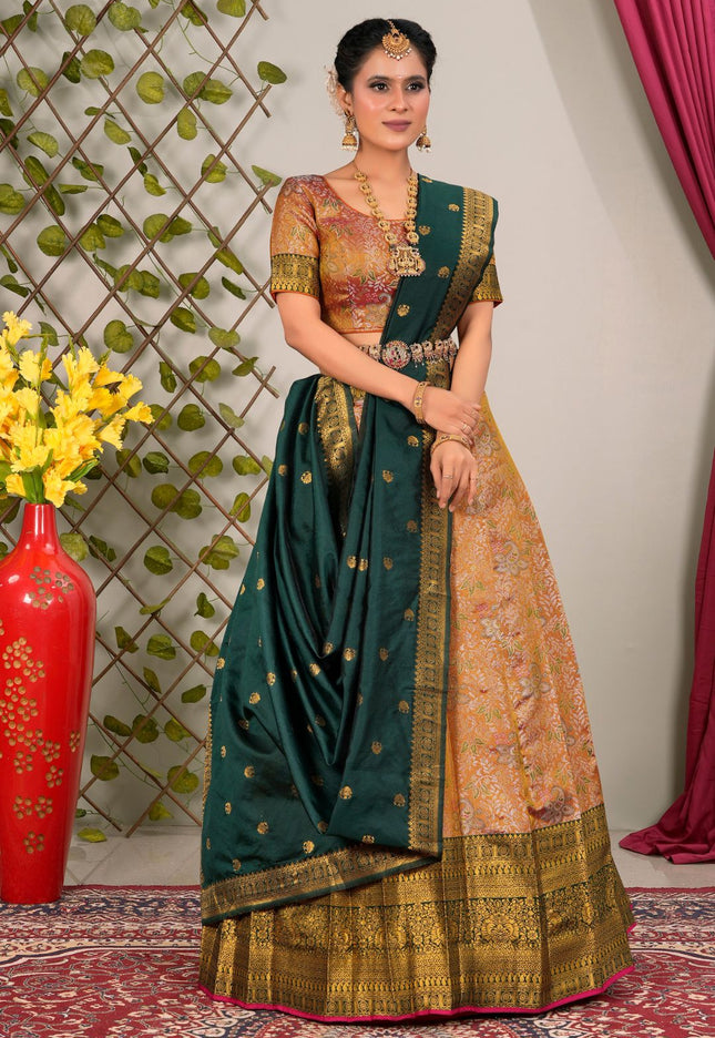 Woman in traditional lehenga choli with green and gold patterns