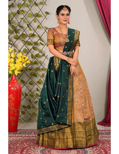 Woman in traditional lehenga choli with green and gold patterns