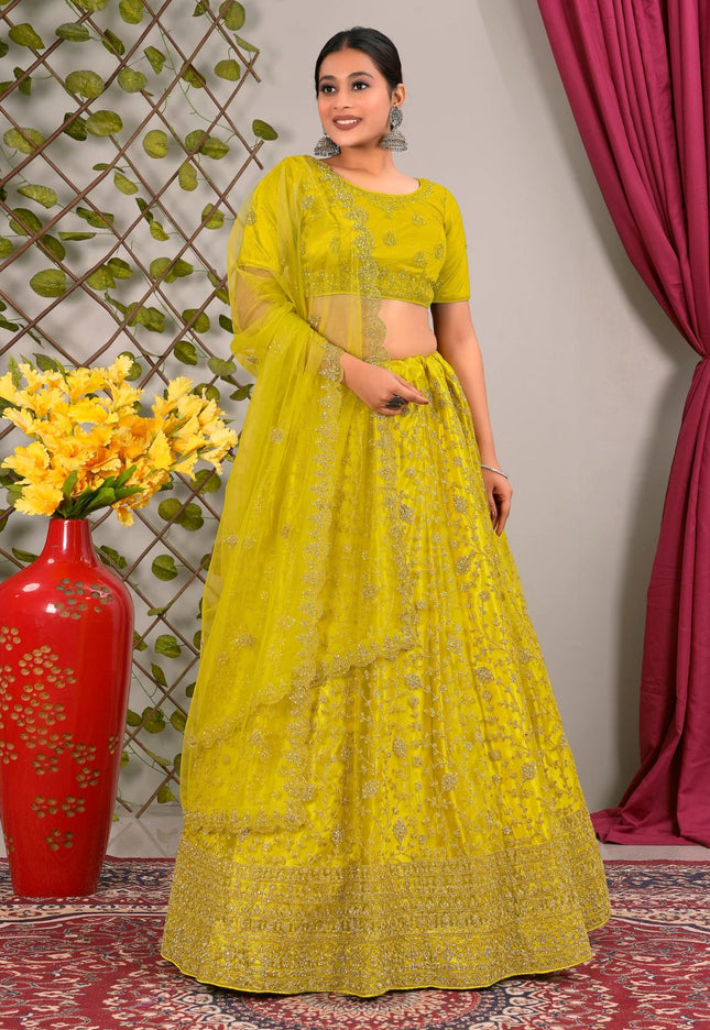 Woman in a yellow traditional lehenga choli with matching dupatta