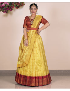 Woman wearing a yellow lehenga with red blouse