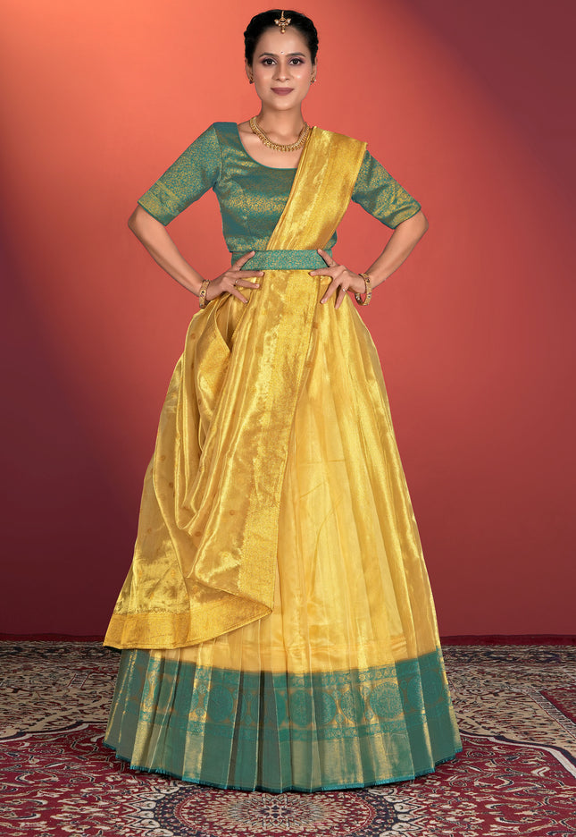 Woman wearing a yellow traditional outfit, lehenga