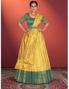 Woman wearing a yellow traditional outfit, lehenga