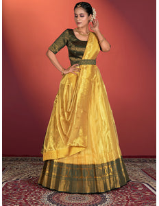 Woman wearing a yellow and green traditional lehenga choli