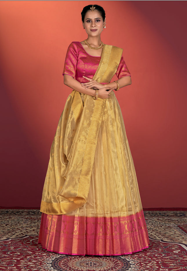 Woman wearing a traditional yellow and pink lehenga choli