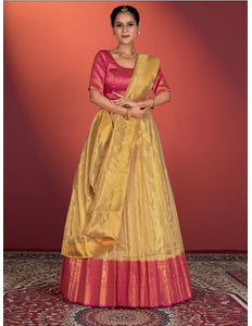Woman wearing a traditional yellow and pink lehenga choli