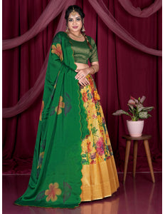 Woman in a green and yellow lehenga with floral patterns