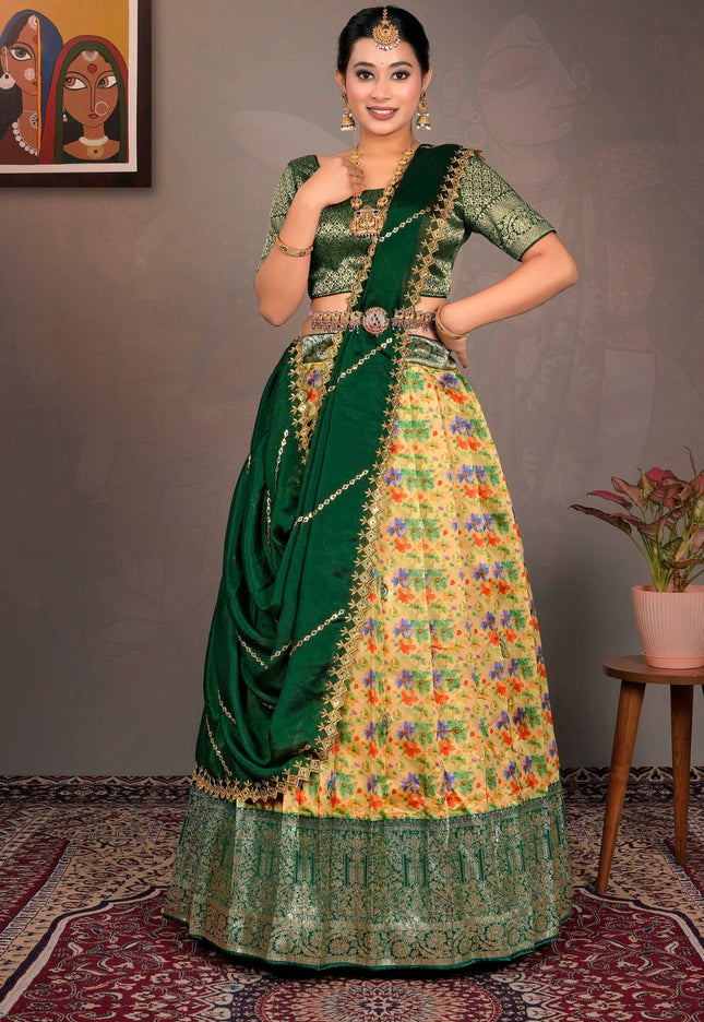 Woman wearing a traditional green and multicolored lehenga choli with dupatta