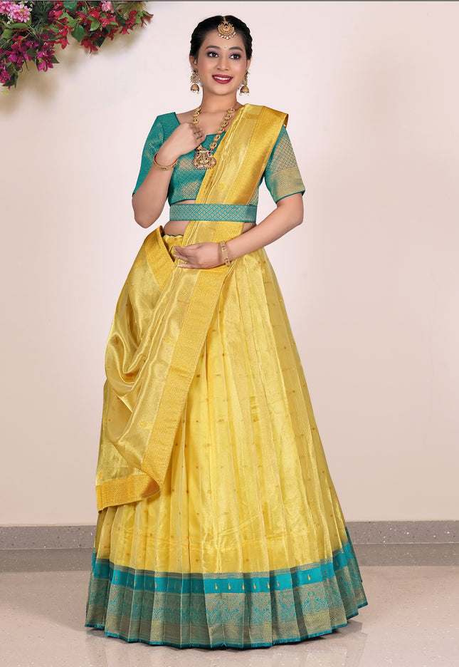 Woman wearing a yellow Lehenga with green blouse