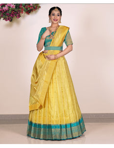 Woman wearing a yellow Lehenga with green blouse