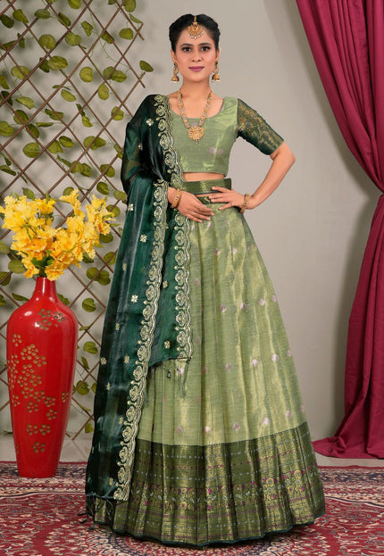 Woman in a green traditional lehenga choli with dupatta