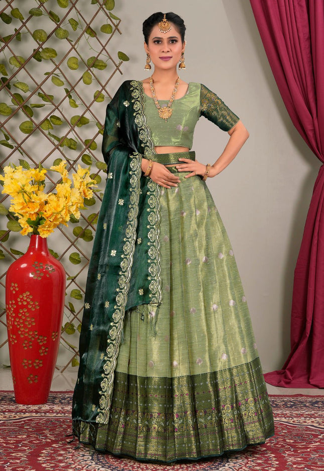 Woman in a green traditional lehenga choli with dupatta