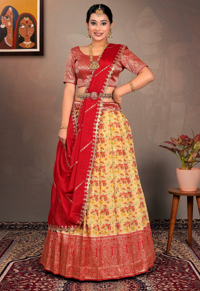 Woman in a red and yellow traditional lehenga choli with dupatta